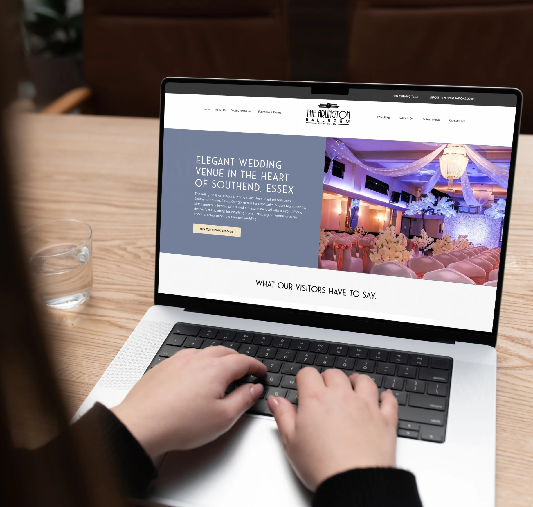 The Arlington Ballroom website shown on a laptop